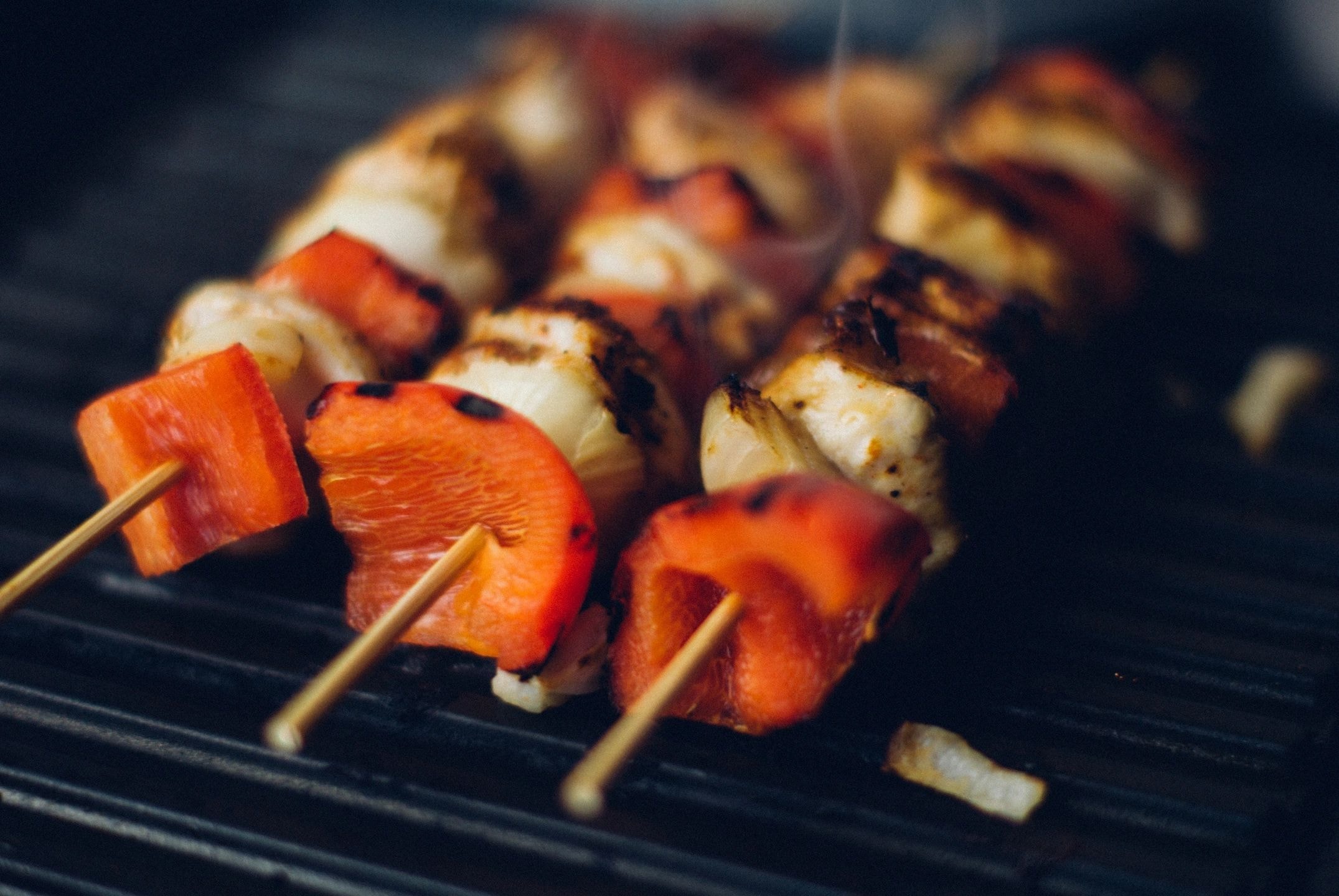 Grilled kebab skewers on grill